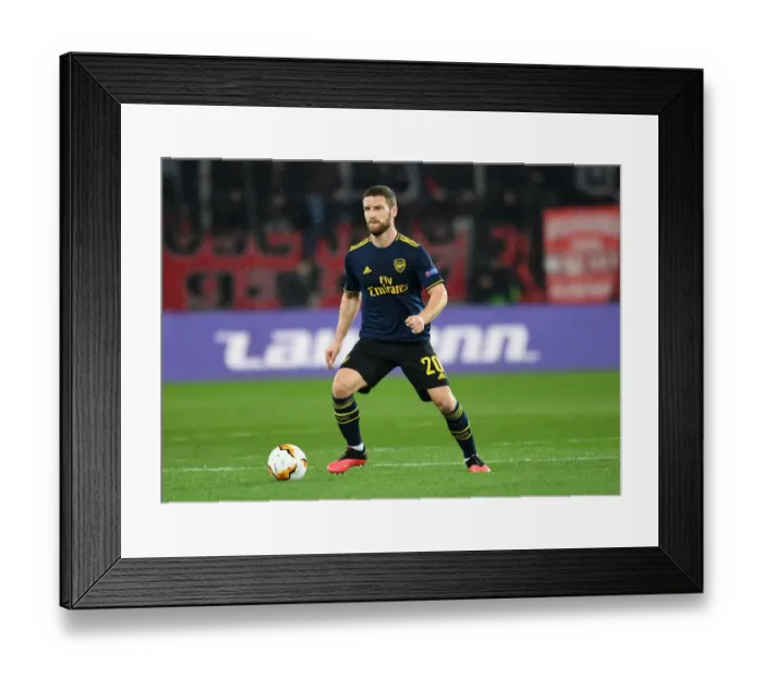 Framed Print : Arsenal's Mustafi Faces Off Against Olympiacos in Europa League Clash Framed Print : Arsenal's Mustafi Faces Off Against Olympiacos in Europa League Clash
