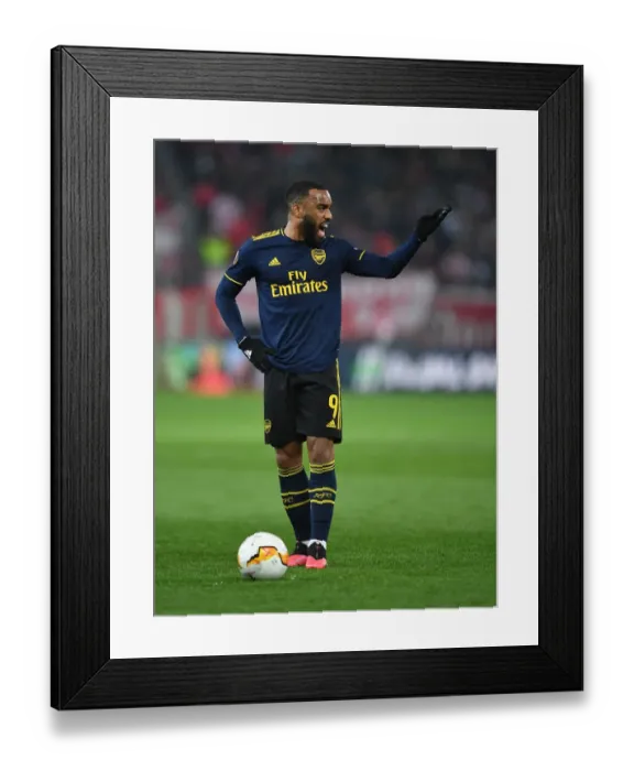 Framed Print : Arsenal's Alexandre Lacazette in Action against Olympiacos in UEFA Europa League Round of 32 First Leg