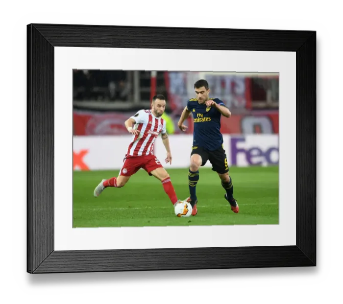Framed Print : Arsenal's Sokratis Faces Off Against Valbuena in UEFA Europa League Showdown, Piraeus 2020