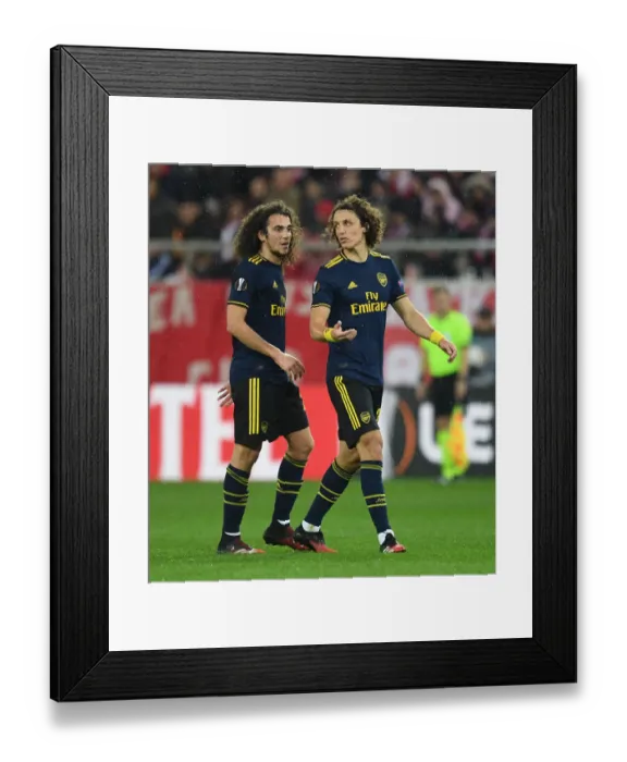 Framed Print : Arsenal's Guendouzi and Luiz Face Off Against Olympiacos in Europa League Clash