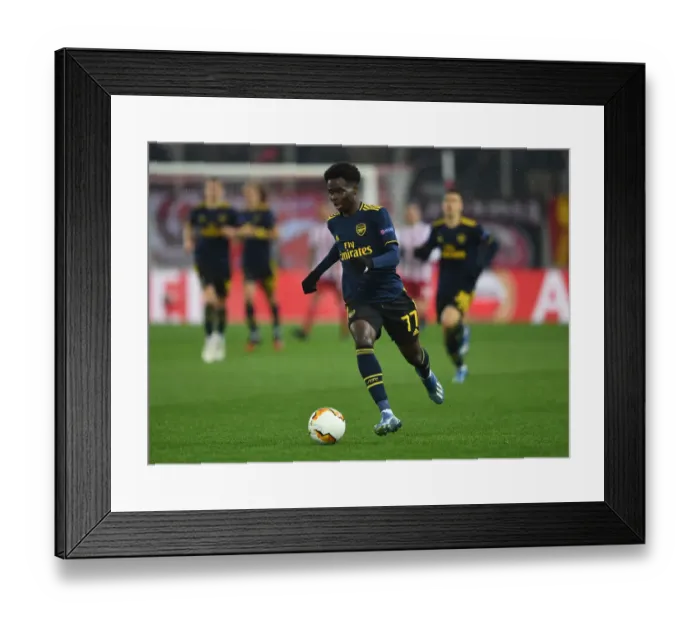 Framed Print : Bukayo Saka in Action: Olympiacos vs. Arsenal - UEFA Europa League 2019-2020 (First Leg)