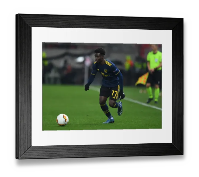 Framed Print : Bukayo Saka in Action: Olympiacos vs Arsenal, UEFA Europa League Round of 32 - First Leg (February 2020)