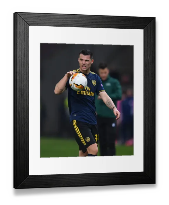 Framed Print : Granit Xhaka in Action: Arsenal vs. Olympiacos, Europa League Round of 32 (2020)
