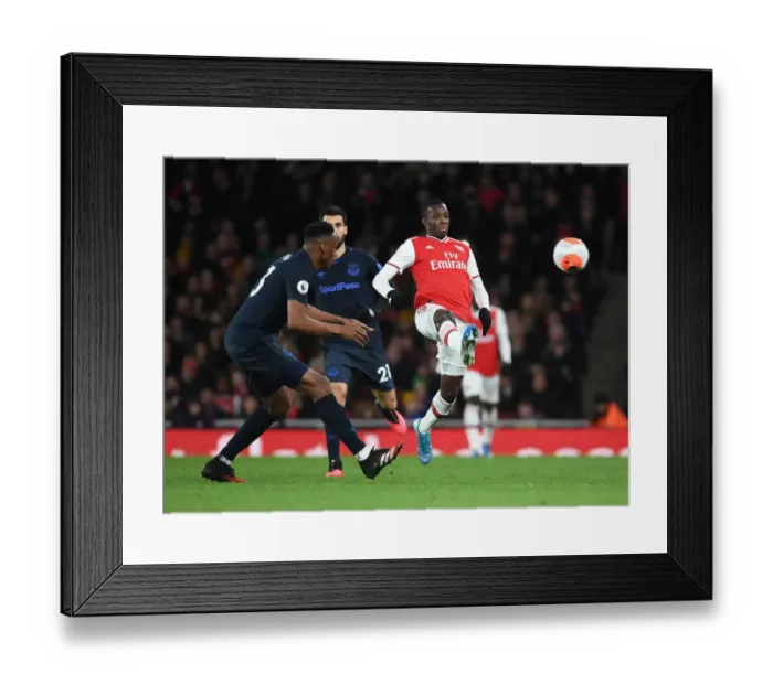 Framed Print : Intense Showdown: Nketiah vs. Mina in Arsenal's Battle Against Everton Framed Print : Intense Showdown: Nketiah vs. Mina in Arsenal's Battle Against Everton