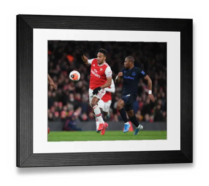 Framed Print : Arsenal's Aubameyang Scores Past Everton's Sidibe in Premier League Showdown