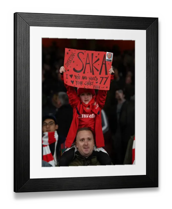 Framed Print : Arsenal Fans Celebrate with Bukayo Saka Poster after Arsenal vs. Everton Match, Premier League 2019-2020