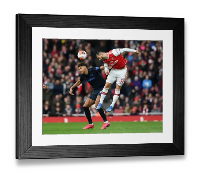 Framed Print : Arsenal vs Everton: Kolasinac Heads Off Under Pressure in Intense Premier League Clash