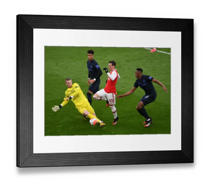 Framed Print : Arsenal vs Everton: Ozil Goes Head-to-Head with Holgate, Mina, and Pickford in Intense Premier League Clash