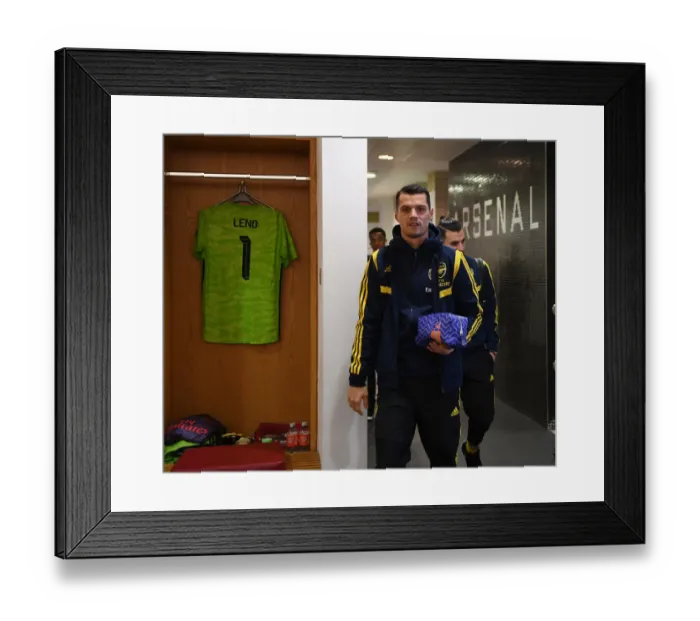 Framed Print : Granit Xhaka in Arsenal Changing Room Before Arsenal v Olympiacos UEFA Europa League Match