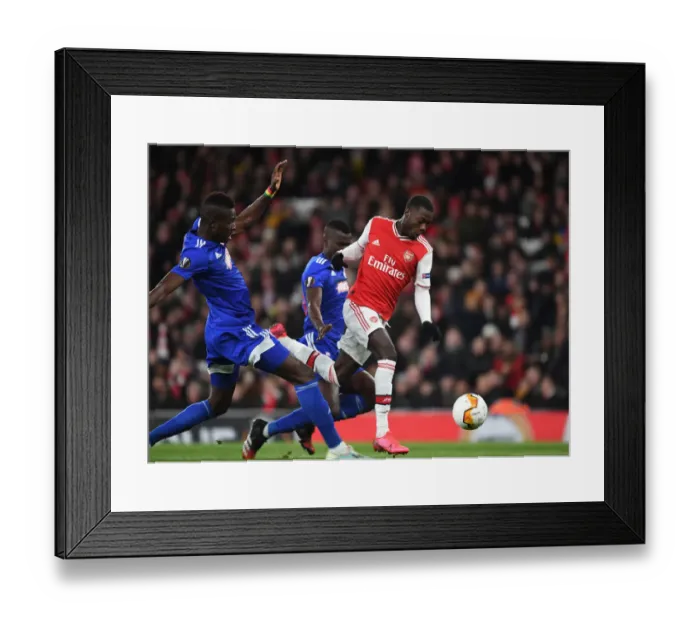 Framed Print : Arsenal's Nicolas Pepe Outmaneuvers Olympiacos Pape Abou Cisse in Europa League Clash Framed Print : Arsenal's Nicolas Pepe Outmaneuvers Olympiacos Pape Abou Cisse in Europa League Clash
