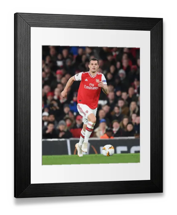 Framed Print : Arsenal's Granit Xhaka in Europa League Clash Against Olympiacos Framed Print : Arsenal's Granit Xhaka in Europa League Clash Against Olympiacos