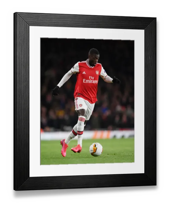Framed Print : Arsenal's Nicolas Pepe in Action: Europa League Clash Against Olympiacos Framed Print : Arsenal's Nicolas Pepe in Action: Europa League Clash Against Olympiacos