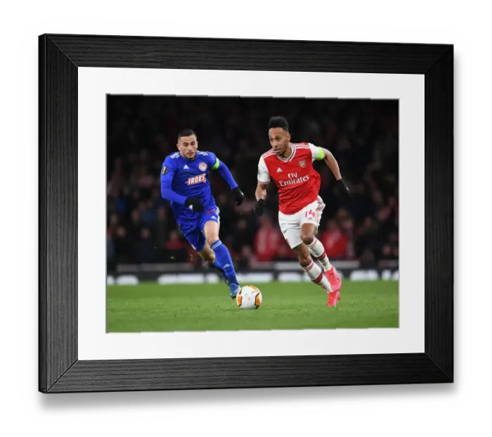 Framed Print : Aubameyang vs. Elabdellaoui: Arsenal's Star Forward Clashes with Olympiacos Defender in Europa League Showdown