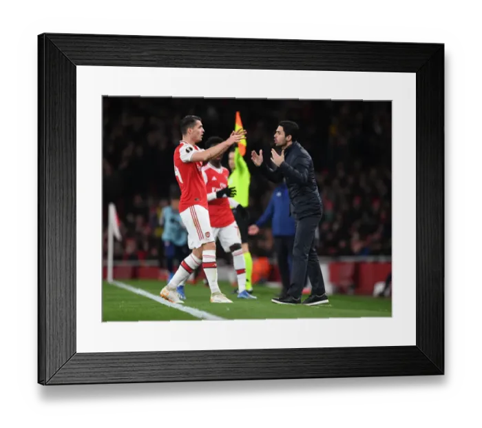 Framed Print : Arsenal FC vs Olympiacos FC: Mikel Arteta and Granit Xhaka Lead the Charge in UEFA Europa League Clash at Emirates Stadium