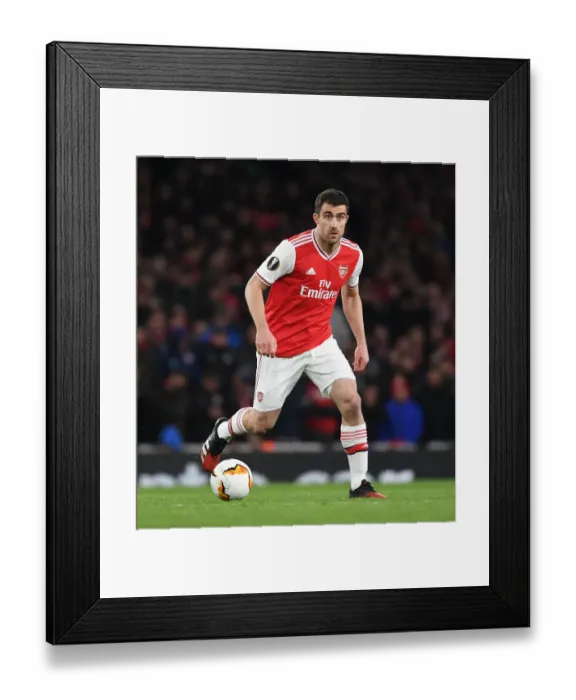 Framed Print : Arsenal's Sokratis in Action against Olympiacos in Europa League Clash