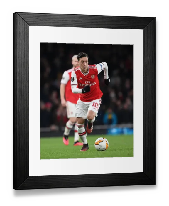 Framed Print : Arsenal's Mesut Ozil in Europa League Action against Olympiacos at Emirates Stadium Framed Print : Arsenal's Mesut Ozil in Europa League Action against Olympiacos at Emirates Stadium