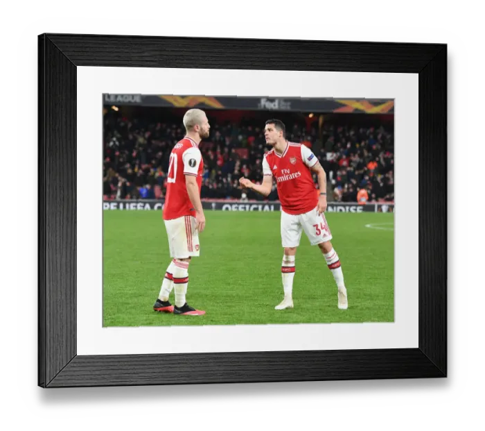 Framed Print : Arsenal FC vs Olympiacos FC: Europa League Clash - Mustafi and Xhaka in Action