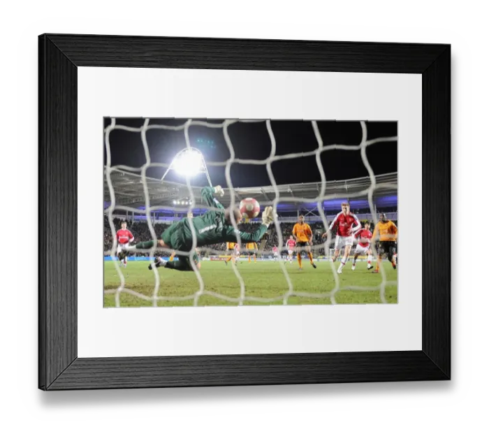 Framed Print : Nicklas Bendtner shoots past Hull goalkeeper Boaz Myhill to score the 2nd Arsenal goal