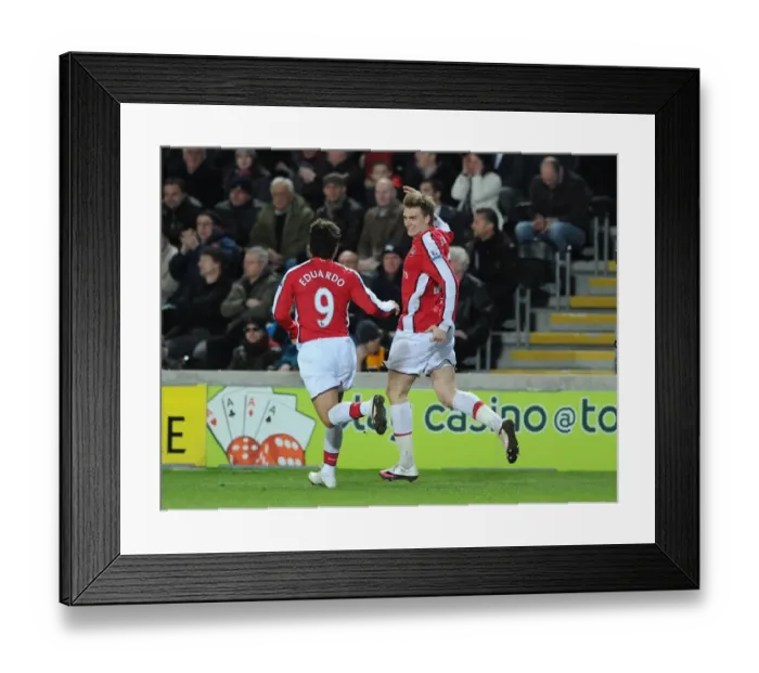 Framed Print : Nicklas Bendtner celebrates scoring the 2nd Arsenal goal with Eduardo. Hull City 1