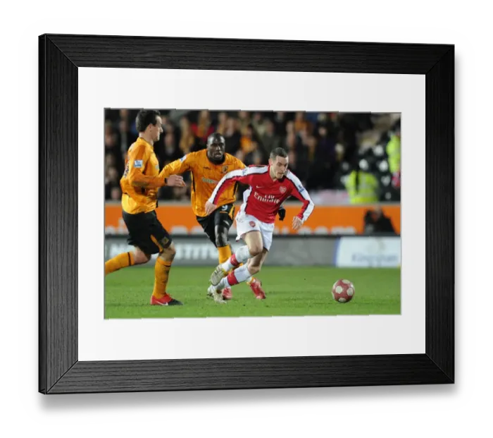 Framed Print : Arsenal's Abou Diaby and Jan Vennegoor of Hesselink Secure Victory Over Hull's Kamil Zayette: 2-1 Barclays Premier League Clash Framed Print : Arsenal's Abou Diaby and Jan Vennegoor of Hesselink Secure Victory Over Hull's Kamil Zayette: 2-1 Barclays Premier League Clash