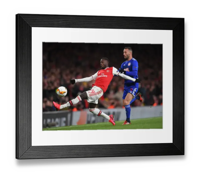 Framed Print : Arsenal vs Olympiacos: Pepe Faces Off in Europa League Clash at Emirates Stadium Framed Print : Arsenal vs Olympiacos: Pepe Faces Off in Europa League Clash at Emirates Stadium