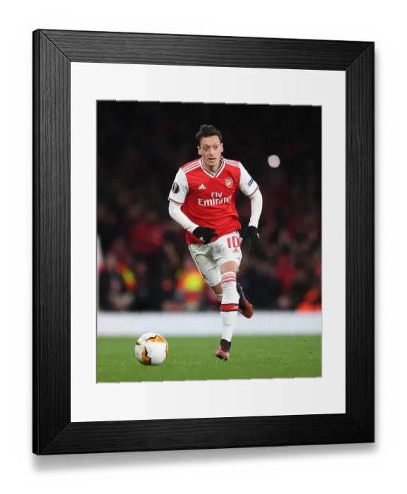 Framed Print : Arsenal's Mesut Ozil in Action against Olympiacos in the Europa League Round of 32 (2019-20)