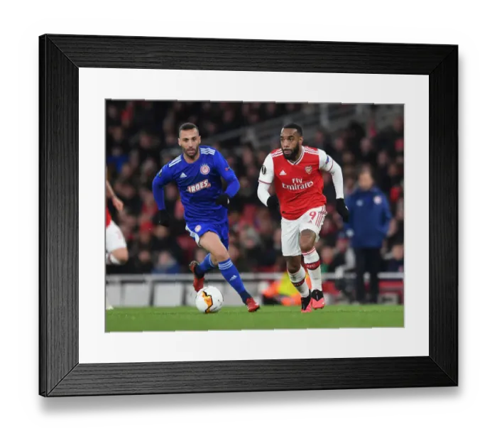 Framed Print : Arsenal's Lacazette Clashes with Olympiacos Guilherme in Europa League Showdown