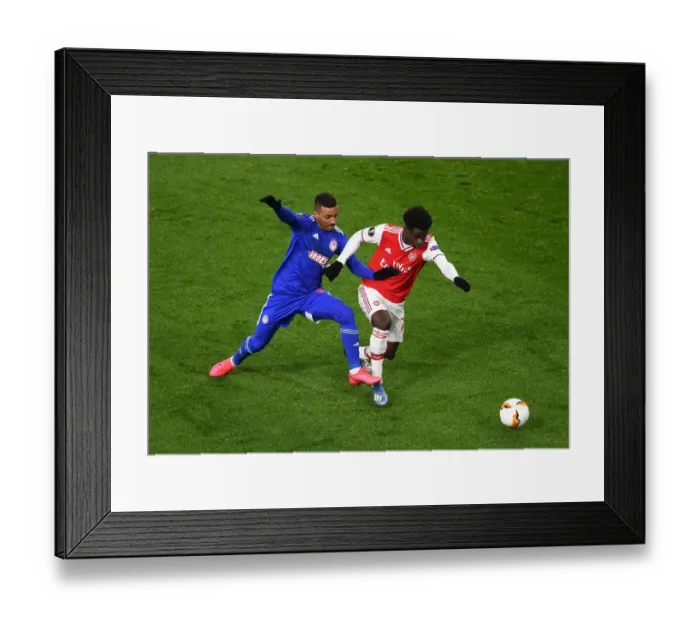 Framed Print : Bukayo Saka vs Bruno Gaspar: Intense Europa League Showdown at Arsenal's Emirates Stadium Framed Print : Bukayo Saka vs Bruno Gaspar: Intense Europa League Showdown at Arsenal's Emirates Stadium