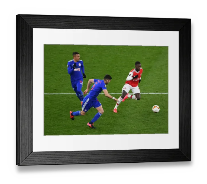 Framed Print : Pepe vs. Bouchalakis: Intense Clash in Arsenal's Europa League Battle against Olympiacos