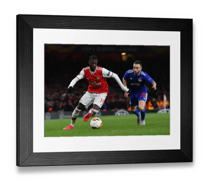 Framed Print : Arsenal's Nicolas Pepe Clashes with Olympiacos Mathieu Vilbuena in Europa League Showdown