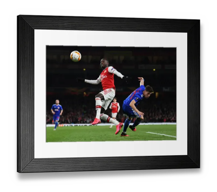 Framed Print : Arsenal vs Olympiacos: Pepe Under Pressure in Europa League Clash Framed Print : Arsenal vs Olympiacos: Pepe Under Pressure in Europa League Clash