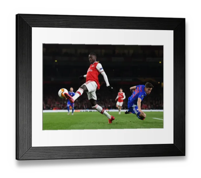 Framed Print : Pepe vs Tsimikas: A Europa League Battle at Arsenal's Emirates Stadium