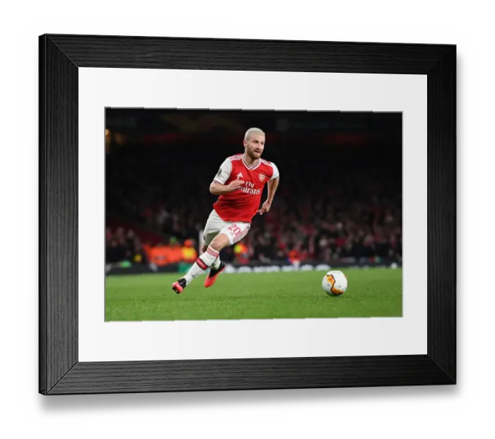 Framed Print : Mustafi Stands Firm: Arsenal vs. Olympiacos Europa League Clash