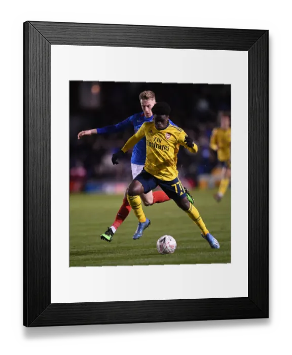 Framed Print : Portsmouth vs Arsenal: FA Cup Fifth Round Clash - Bukayo Saka Faces Off Against Ross McCrorie