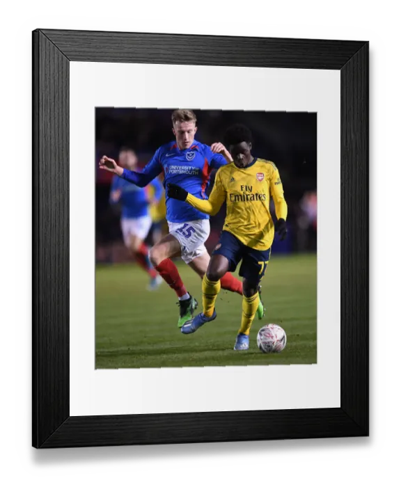 Framed Print : FA Cup Fifth Round Battle: Saka vs. McCrorie - Portsmouth vs. Arsenal Framed Print : FA Cup Fifth Round Battle: Saka vs. McCrorie - Portsmouth vs. Arsenal