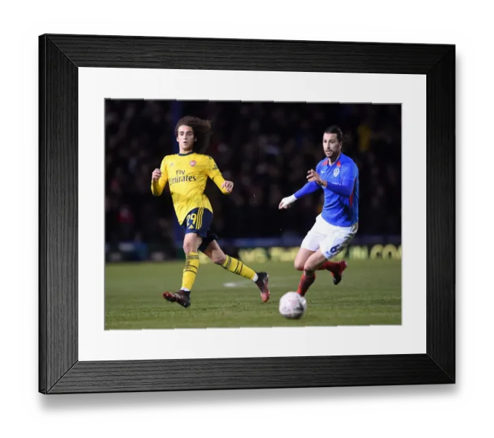 Framed Print : Guendouzi vs Burgess: FA Cup Fifth Round Battle at Fratton Park Framed Print : Guendouzi vs Burgess: FA Cup Fifth Round Battle at Fratton Park
