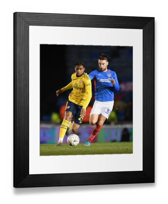 Framed Print : Arsenal's Reiss Nelson Faces Off Against Portsmouth's Ben Close in FA Cup Fifth Round Showdown