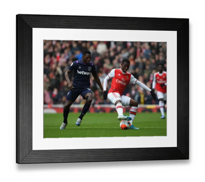 Framed Print : Arsenal's Eddie Nketiah Shields Off Against West Ham's Jeremy Ngakia in Premier League Clash Framed Print : Arsenal's Eddie Nketiah Shields Off Against West Ham's Jeremy Ngakia in Premier League Clash
