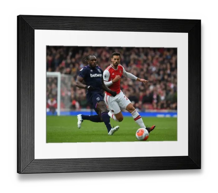 Framed Print : Arsenal vs. West Ham: Pablo Mari Closes In on Michail Antonio in Intense Premier League Clash Framed Print : Arsenal vs. West Ham: Pablo Mari Closes In on Michail Antonio in Intense Premier League Clash