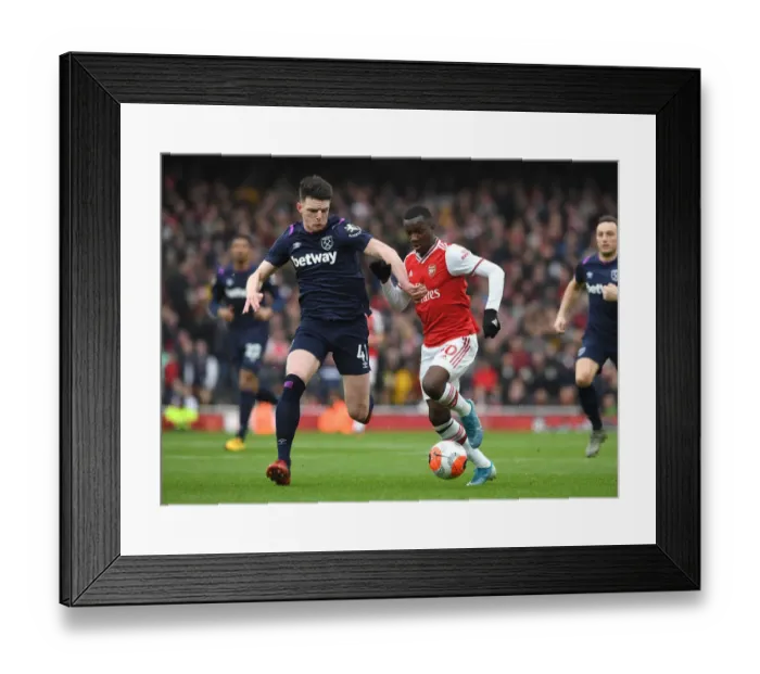 Framed Print : Arsenal's Eddie Nketiah Faces Off Against West Ham's Declan Rice in Premier League Clash