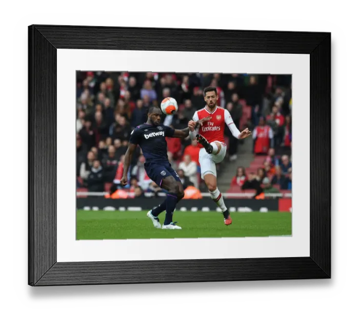 Framed Print : Arsenal's Pablo Mari Fends Off West Ham's Michail Antonio Pressure During Premier League Clash