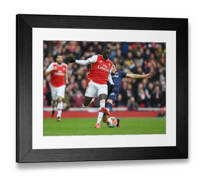 Framed Print : Arsenal vs. West Ham: Pepe vs. Fornals - Premier League Clash at Emirates Stadium Framed Print : Arsenal vs. West Ham: Pepe vs. Fornals - Premier League Clash at Emirates Stadium