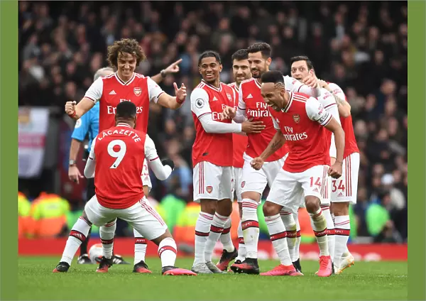 Arsenal's Star Players Celebrate Lacazette's Goal Against West Ham United in the Premier League 2019-20: A Moment of Triumph at Emirates Stadium with David Luiz, Reiss Nelson, Pablo Mari, and Pierre-Emerick Aubameyang