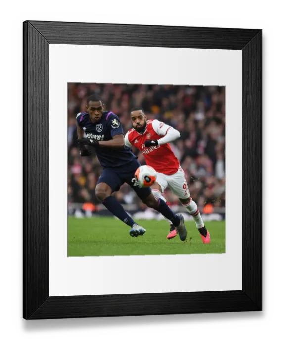 Framed Print : Arsenal's Lacazette Clashes with West Ham's Diop in Premier League Showdown