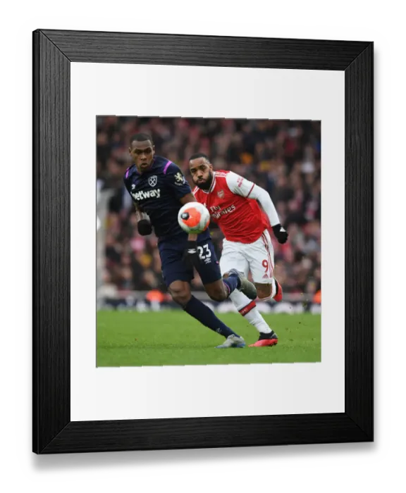 Framed Print : Intense Rivalry: Lacazette vs. Diop Clash in Arsenal vs. West Ham Premier League Battle Framed Print : Intense Rivalry: Lacazette vs. Diop Clash in Arsenal vs. West Ham Premier League Battle
