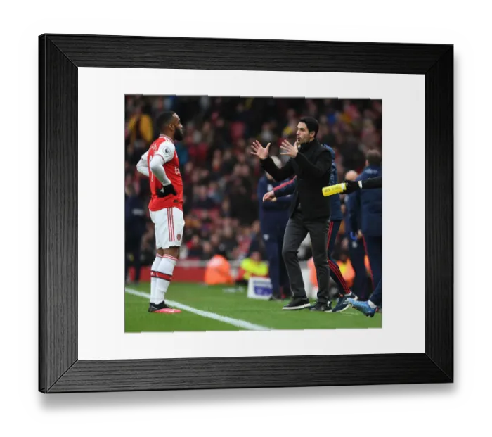 Framed Print : Arsenal's Mikel Arteta Coaches Alexis Lacazette Amidst Premier League Clash Against West Ham Framed Print : Arsenal's Mikel Arteta Coaches Alexis Lacazette Amidst Premier League Clash Against West Ham