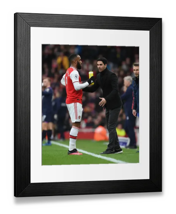 Framed Print : Arsenal's Mikel Arteta Coaches Alexis Lacazette Amid Intense Arsenal v West Ham United Clash (2019-20) Framed Print : Arsenal's Mikel Arteta Coaches Alexis Lacazette Amid Intense Arsenal v West Ham United Clash (2019-20)
