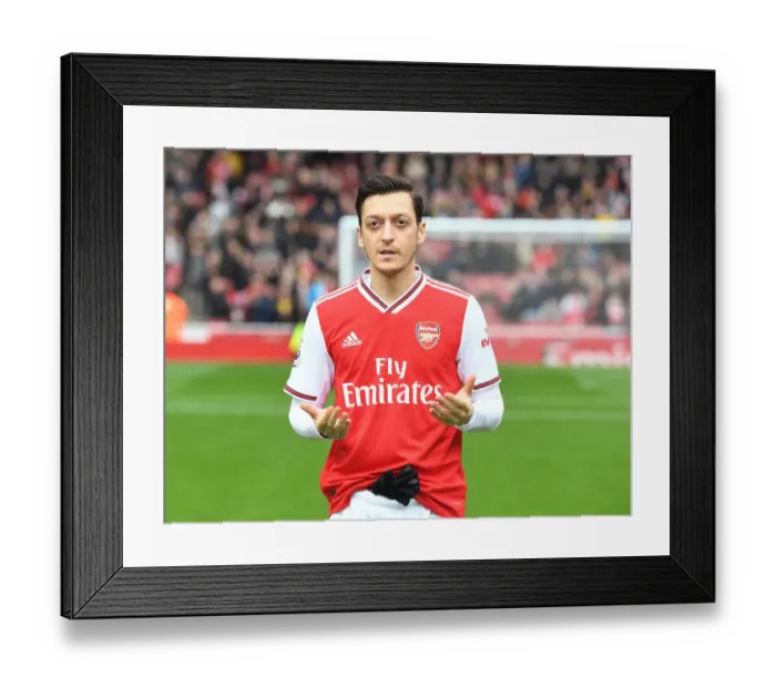 Framed Print : Arsenal's Mesut Ozil in Prayer Before Arsenal v West Ham Premier League Match
