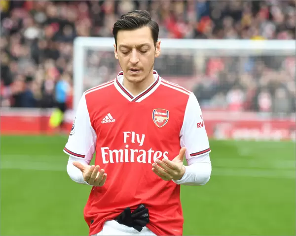 Mesut Ozil in Prayer: Arsenal Football Club's Pre-Match Focus before Arsenal vs West Ham