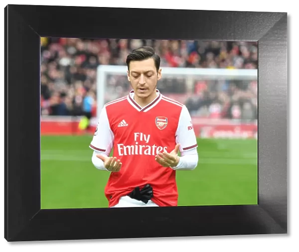 Mesut Ozil in Prayer: Arsenal Football Club's Pre-Match Focus before Arsenal vs West Ham